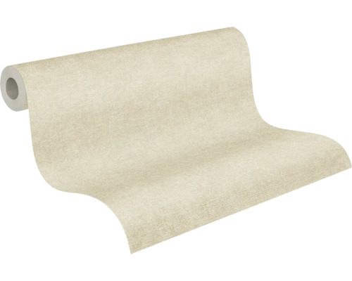 Strukturierte Vliestapete in Beige, einfarbig, teilweise abgerollt.