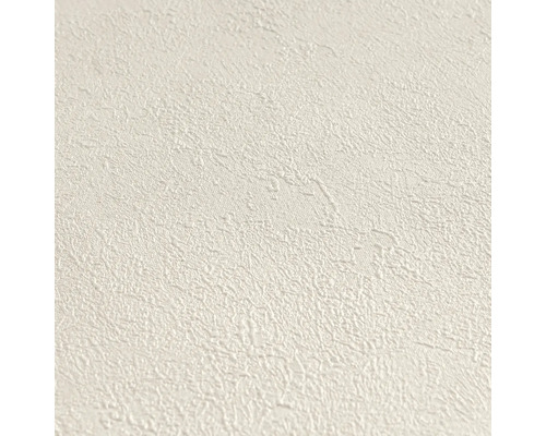Strukturierte Vliestapete mit feiner, unregelmäßiger Körnung in Creme.
