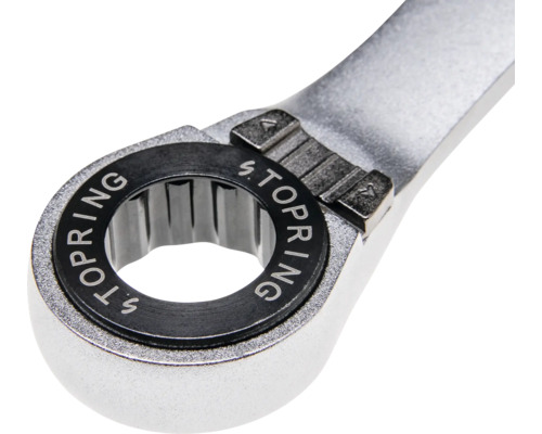 Nahaufnahme eines Ring-Ratschenschlüssels aus Metall mit Stopring-Schriftzug und Umschalter für die Drehrichtung.