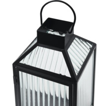 Schwarze Metalllaterne mit geriffeltem Glas und Tragegriff.