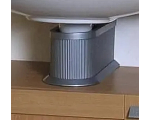 Siphonverkleidung aus Kunststoff mit gerippter Oberfläche unter einem Waschbecken auf einem Unterschrank.
