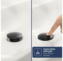 Matte schwarze Push-Open-Ablaufgarnitur für Waschbecken. Die Bedienung erfolgt durch einfaches Drücken zum Öffnen und Schließen.