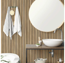 Modernes Badezimmer mit Akustikpaneelen aus Holz, einem runden Spiegel und weißem Aufsatzwaschbecken auf einem Waschtisch.