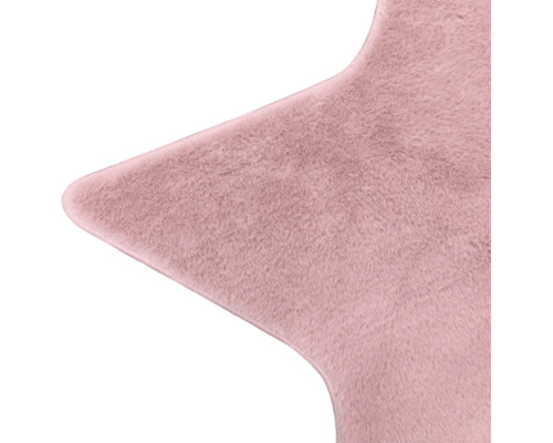 Sternförmiger Teppich aus rosa Kunstfell.