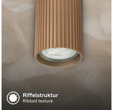 Zylindrischer Deckenstrahler mit Riffelstruktur.