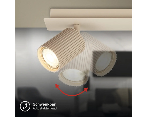 Schwenkbarer Strahler mit geripptem Gehäuse zur flexiblen Lichtausrichtung.