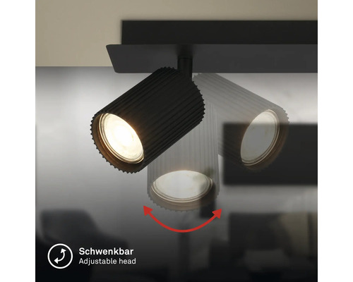 Schwenkbarer schwarzer Strahler mit geriffeltem Gehäuse, Darstellung der Schwenkfunktion des Lampenkopfes.