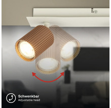 Deckenstrahler mit schwenkbarem, geriffeltem Kopf in Holzoptik.