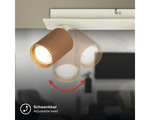 Deckenstrahler mit schwenkbarem, geriffeltem Kopf in Holzoptik.