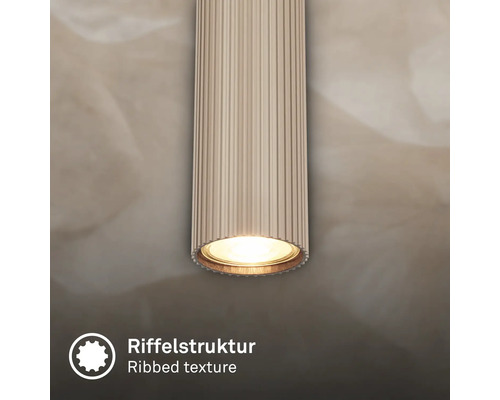 Zylindrische Leuchte mit Riffelstruktur und Licht.