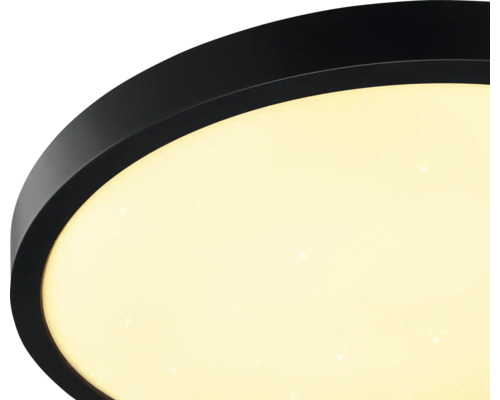 Runde LED-Deckenleuchte mit schwarzem Rand und Diffusor mit Sterneneffekt.