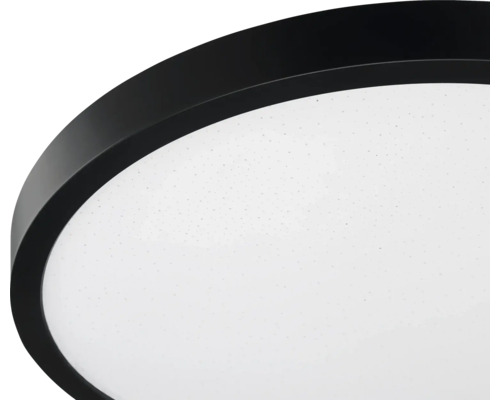 Runde LED-Deckenleuchte mit schwarzem Rand und weißem Diffusor mit Sterneneffekt.