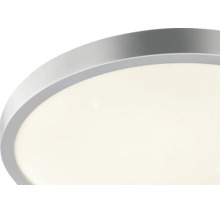 LED-Deckenleuchte mit rundem Metallrahmen und Sterneneffekt.
