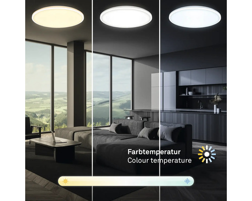 Runde LED-Deckenleuchte in einem modernen Wohnraum mit Küche, zeigt einstellbare Farbtemperaturen von warmem bis kaltem Licht.