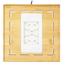 Quadratische LED-Pflanzenlampe mit einem Rahmen aus Bambus und einem zentralen Leuchtfeld mit mehreren Leuchtdioden.