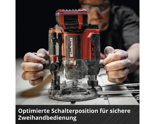 Einhell Professional Oberfräse mit optimierter Schalterposition für sichere Zweihandbedienung auf Holz.