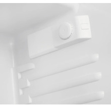 Mechanischer Thermostat-Drehregler im Innenraum eines Kühlschranks mit nummerierten Einstellungen.