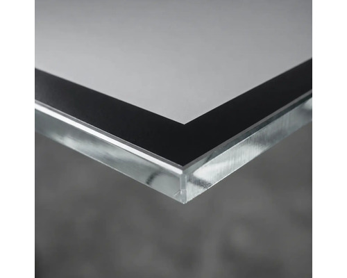 Nahaufnahme einer Ecke eines Acrylglasbildes mit schwarzem Rand.