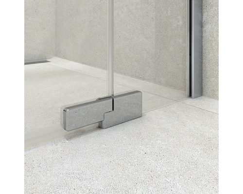 Nahaufnahme eines Duschscharniers an einer Glasduschwand in einem modernen Badezimmer.