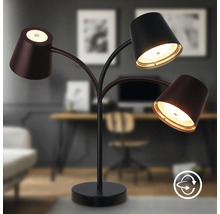 Moderne Schreibtischleuchte mit drei flexiblen Leuchtenarmen und LED Leuchtmitteln für eine gezielte Arbeitsplatzbeleuchtung im Büro.