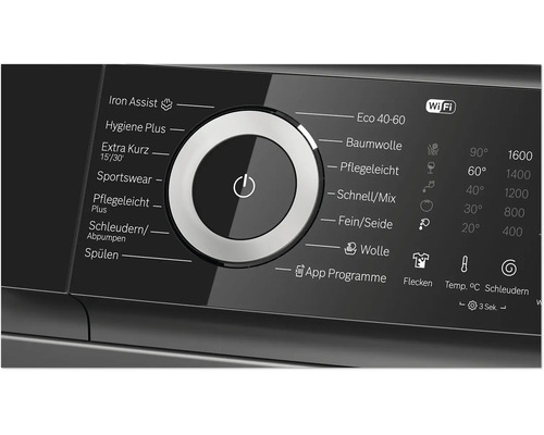 Bedienblende einer Waschmaschine mit Programmwähler und digitalem Display zur Einstellung von Waschprogrammen und Temperaturen.