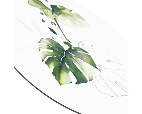 Nahaufnahme eines Tisches mit einem Monstera-Blattmotiv