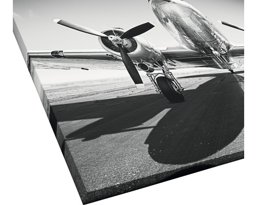 Leinwandbild mit einem Flugzeug im Schwarzweiß-Design