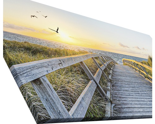 Dekorative Leinwand mit einem Holzsteg zum Strand bei Sonnenuntergang