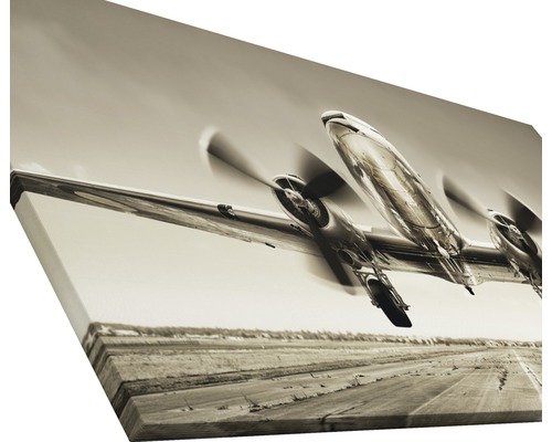 Leinwanddruck mit einem Flugzeug, das startet