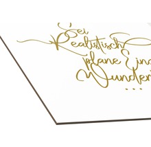 Dekoration mit dem Spruch Sei realistisch plane Wunder