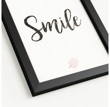 Gerahmtes Bild mit dem Schriftzug Smile und Blattmotiv
