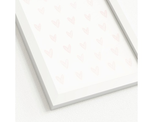 Gerahmtes Bild mit Herzmotiven