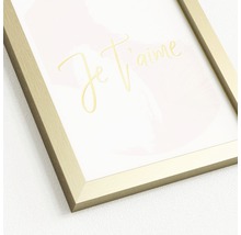 Dekoratives Bild mit goldenem Rahmen und der Aufschrift ''Je t''aime''