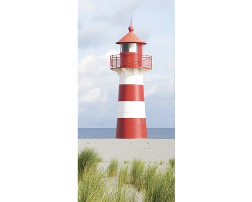 Leuchtturm auf einer Düne mit Bewuchs