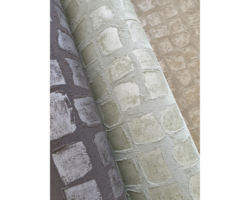 Verschiedenfarbige Tapetenrollen mit Steinmuster