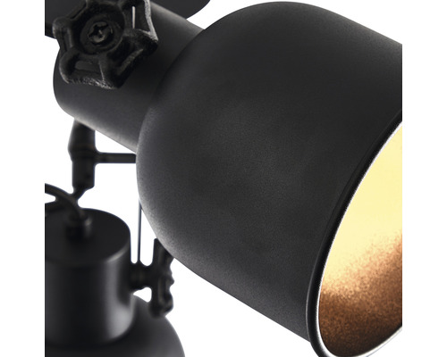 Detailaufnahme einer schwarzen Deckenleuchte mit Spot