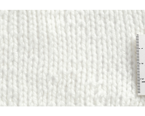 Nahaufnahme eines gestrickten Stoffes mit einem Lineal.