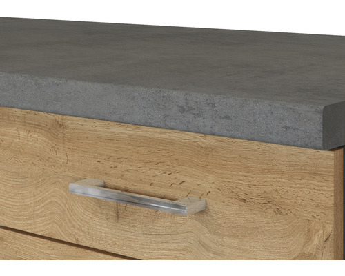 Detailaufnahme eines Möbelstücks mit Schublade, Platte in Betonoptik und Metallgriff