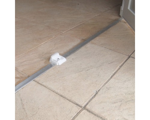 Bodenprofil aus Aluminium mit Kunststoffhalterung auf Fliesenboden