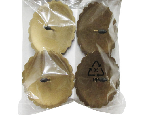 Vier Möbelgleiter mit Blütenrand in einer Verpackung