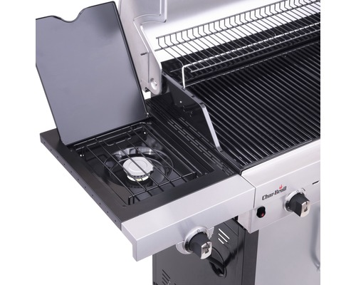 Detailansicht eines Gasgrills mit Seitenbrenner und Warmhalterost.