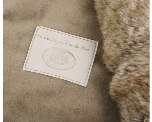 Cozze Qualitätssiegel auf Textil