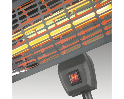 Detailansicht eines Heizstrahlers mit Schutzgitter und Schalter