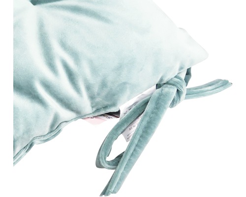 Detailansicht eines Kissens mit Bindebändern