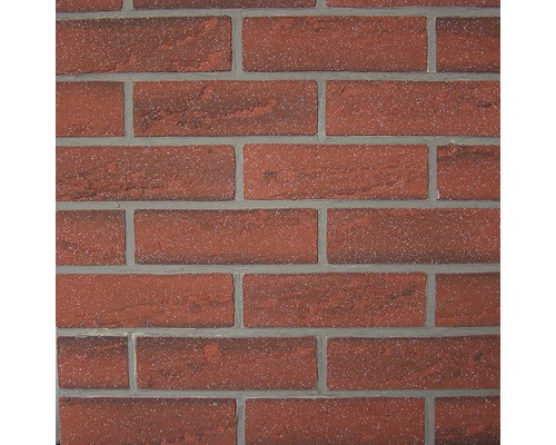 Nahaufnahme einer Wand mit Backsteinoptik.