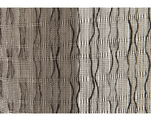 Detailaufnahme eines gewebten Stoffes mit unregelmäßigem Muster