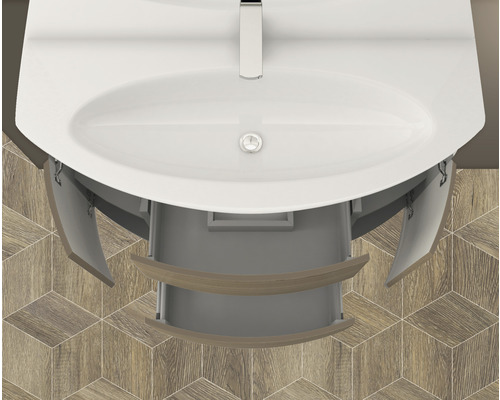 Aufsicht auf Waschbeckenunterschrank mit offenem Schubfach und Türen