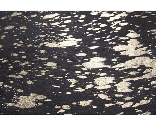 Nahaufnahme einer schwarzen Lederstruktur mit silbernen Farbspritzern