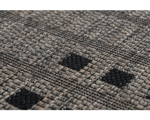 Detailansicht eines getufteten Teppichs mit Muster