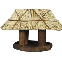 Vogelhaus aus Holz mit Strohdach